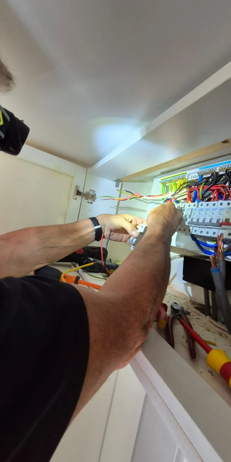 Professional emergency electrician at work in Sussex